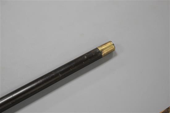 A Victorian walking stick with embossed silver pommel H.M., Birmingham 1906, opens to reveal a compass, overall length 89.5cm